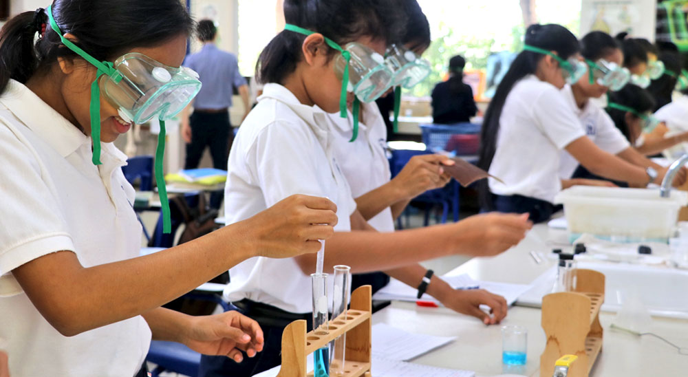 JPA students using chemicals for experiments in the laborotory. Jay Pritzker Academy, Siem Reap, Cambodia. Jay-Pritzker-Academy-Siem-Reap-Cambodia.