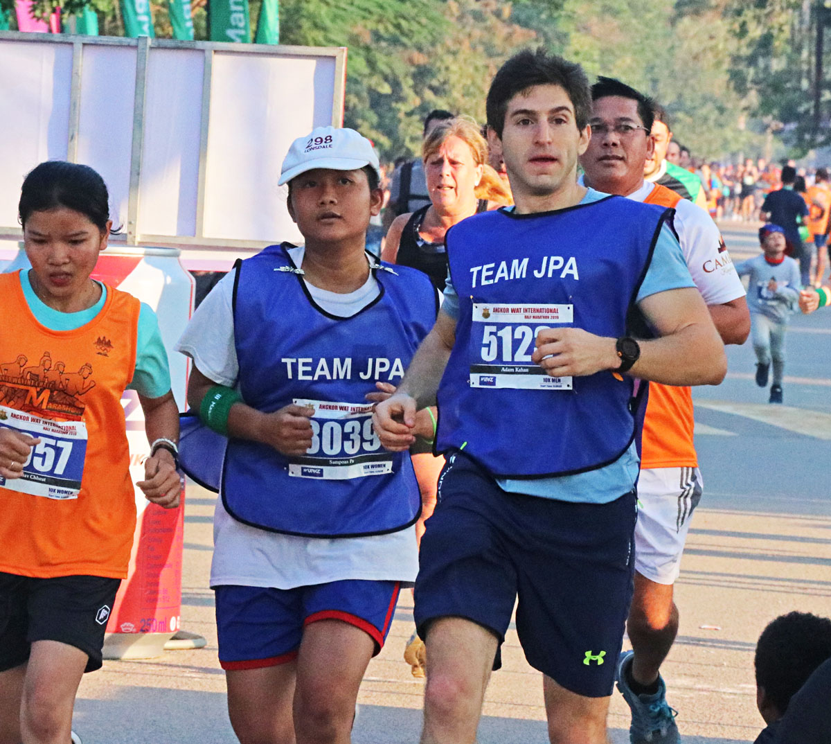 JPA student and teacher competing in the 24th Angkor Wat International Half Marathon 2019. Jay Pritzker Academy, Siem Reap, Cambodia. Jay-Pritzker-Academy-Siem-Reap-Cambodia.